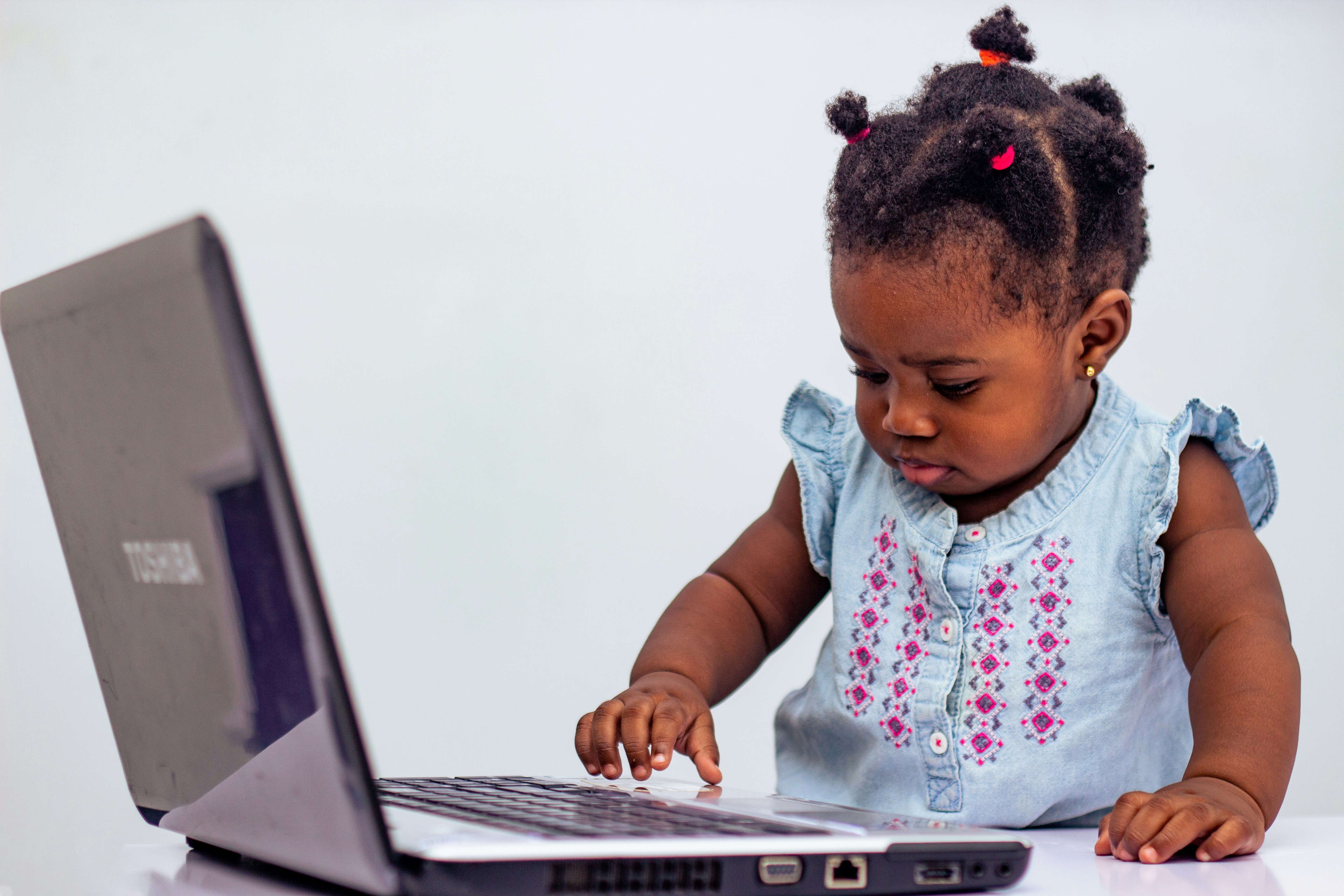 Little girl exploring digital creativity